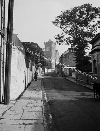 STREET SCENE WITH CHURCH